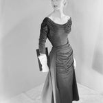 Vogue

Date: November 15th, 1953

Description: A model wearing a rayon matte jersey dress by Ceil Chapman.

Photographer: Horst P. Horst