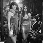 Two Paco Rabanne evening dresses constructed from hundreds of metal rings at a fashion show, 1967
