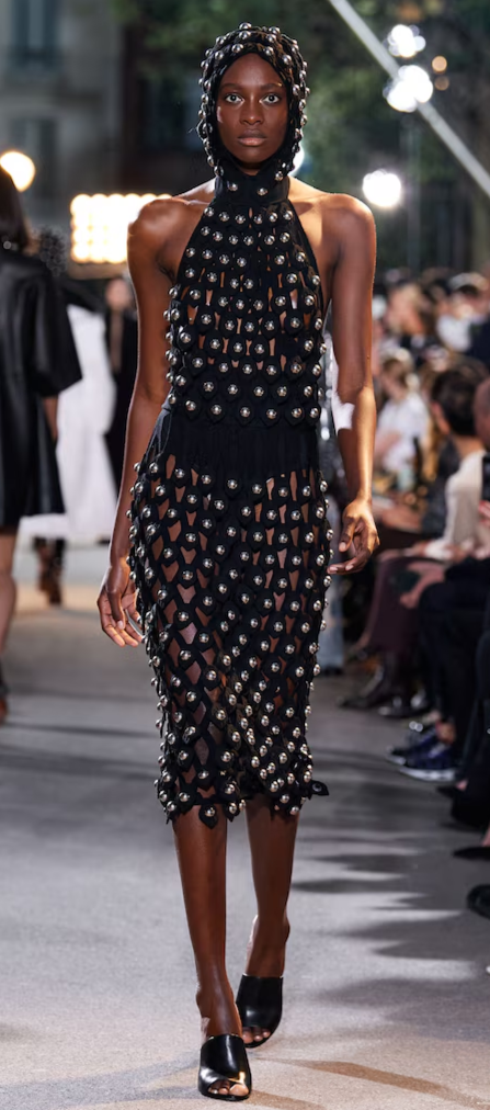 Look 28 Alaia Winter 2022 Black Hooded Net Jersey Dress with Chrome Bauble Studs, runway
