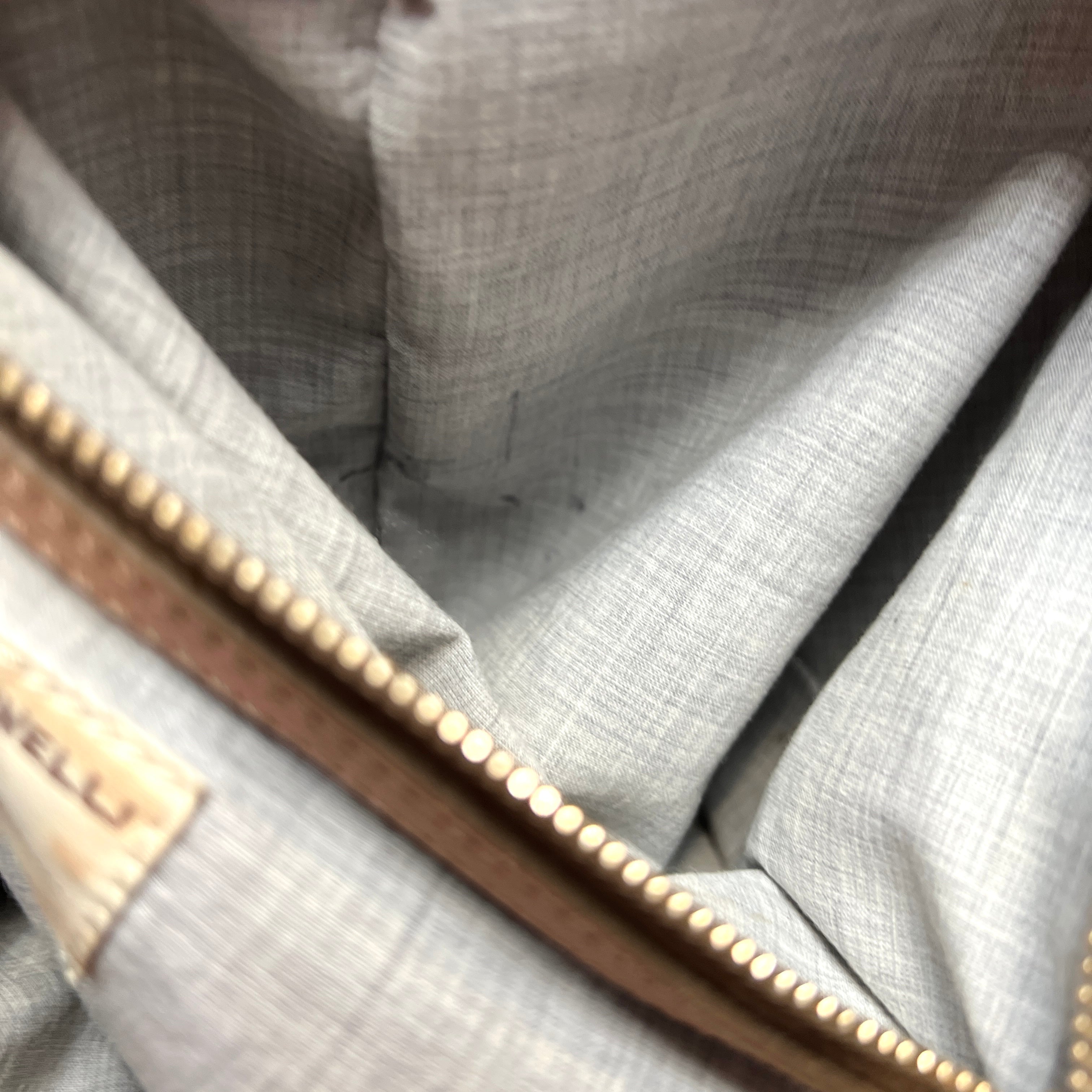 pen mark in interior zip pocket