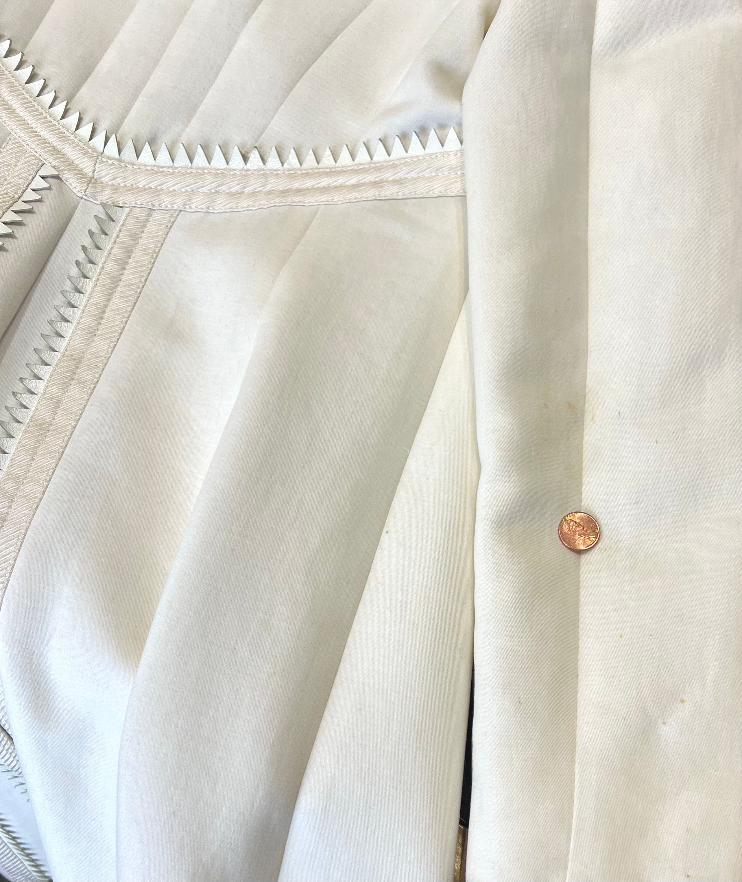 RIGHT BACK OF SLEEVE, TEENY YELLOWING PINPOINTS