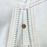 CENTER BACK TEENY YELLOW SPOT