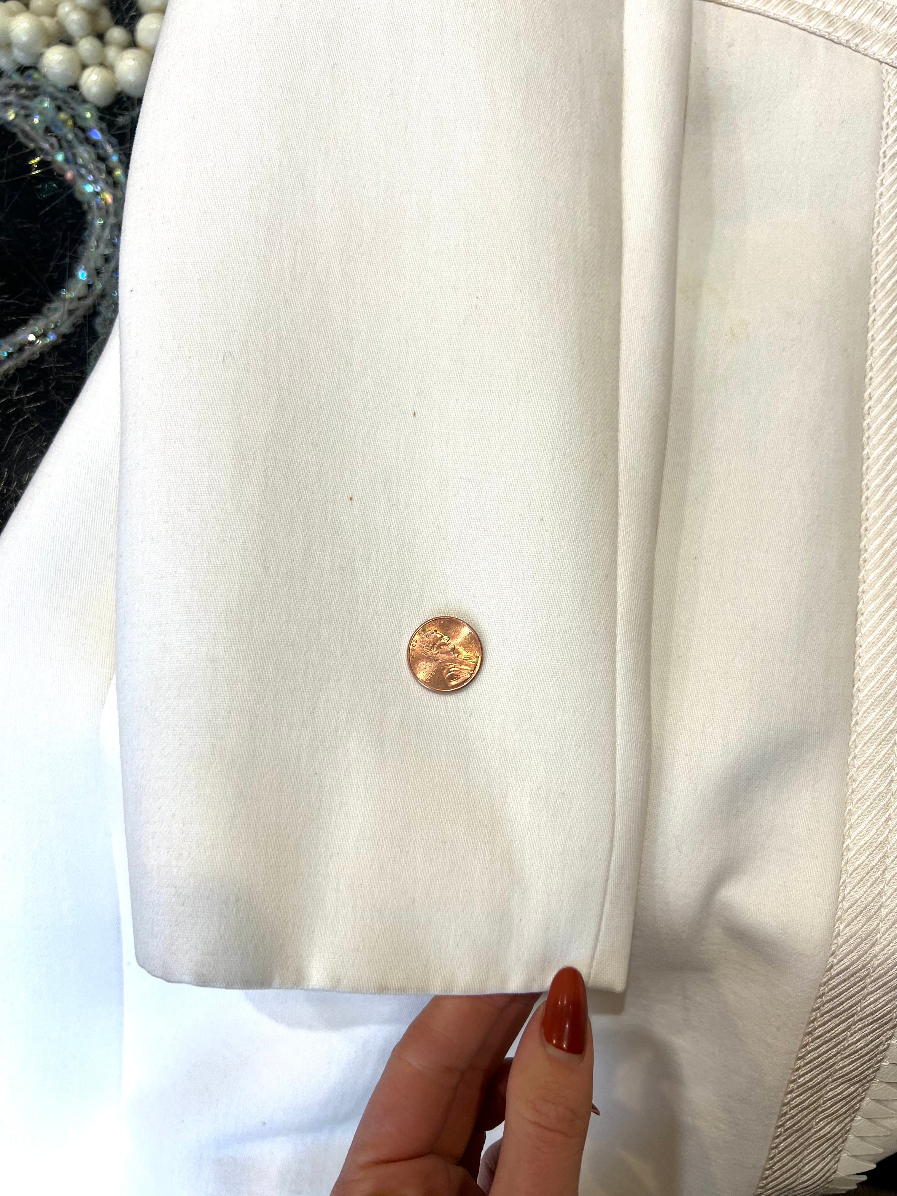 LEFT BACK OF SLEEVE, TEENY PINPOINT SPOTS