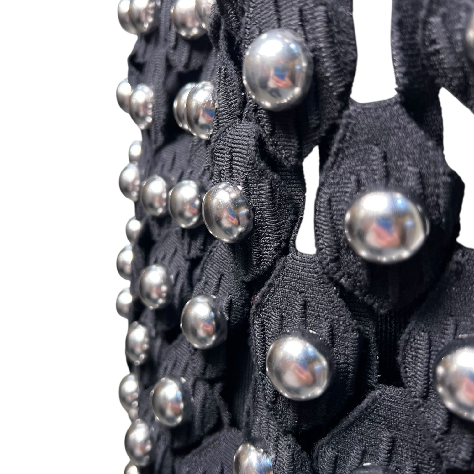 Alaia Winter 2022 Black Hooded Net Jersey Dress with Chrome Bauble Studs, close up 