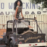 Jody Watley in a Jean Paul Gaultier (Spring/Summer 1989) leopard print denim waistcoat and jean set for her tour book photo shoot (1989