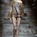 Rie Rasmussen walks the runway during the Yves Saint Laurent Rive Gauche Ready to Wear Spring/Summer 2002 fashion show as part of the Paris Fashion Week on October 9, 2001 in Paris, France. 