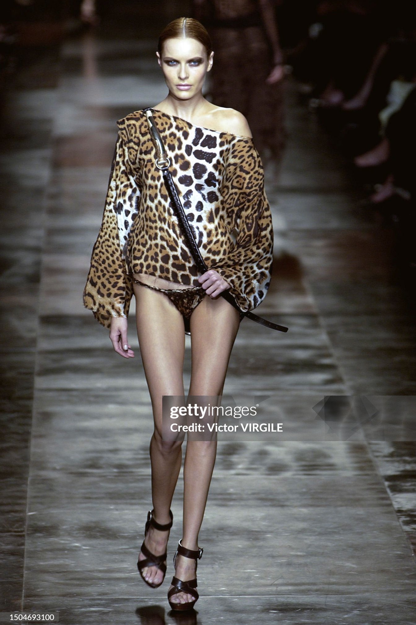 Rie Rasmussen walks the runway during the Yves Saint Laurent Rive Gauche Ready to Wear Spring/Summer 2002 fashion show as part of the Paris Fashion Week on October 9, 2001 in Paris, France. 