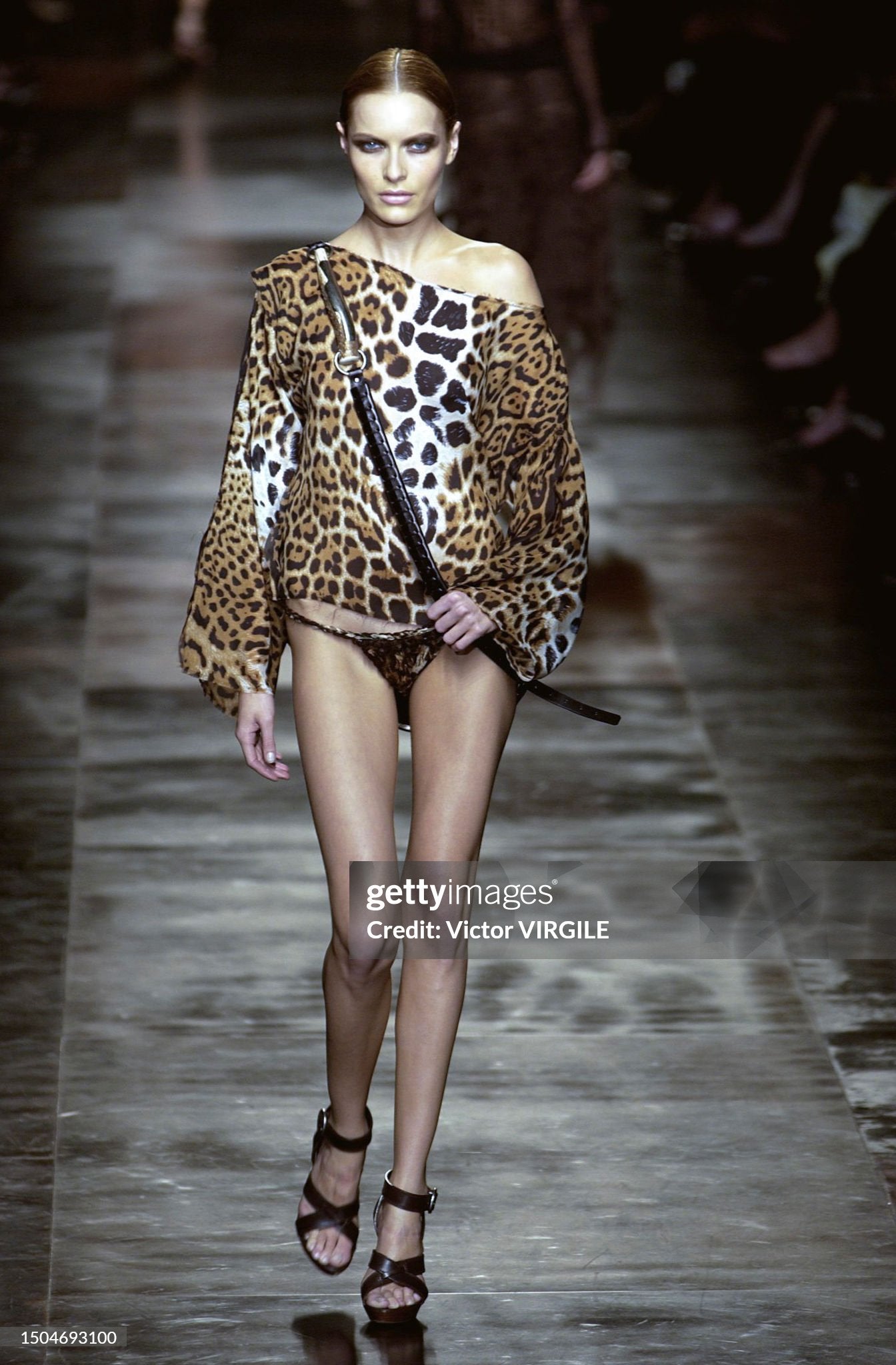 Rie Rasmussen walks the runway during the Yves Saint Laurent Rive Gauche Ready to Wear Spring/Summer 2002 fashion show as part of the Paris Fashion Week on October 9, 2001 in Paris, France. 