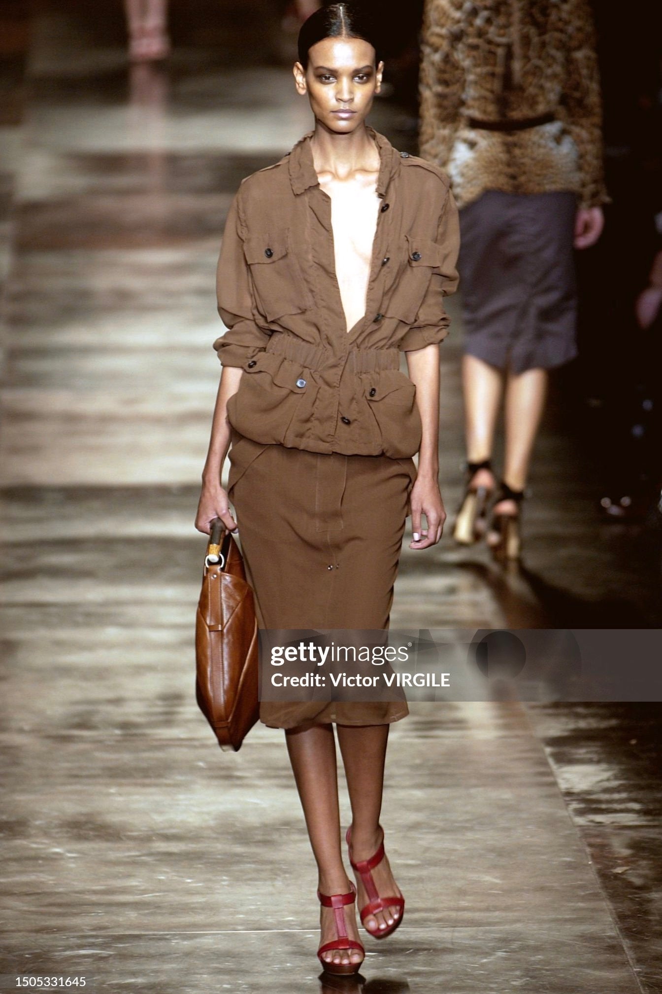 Liya Kebede walks the runway during the Yves Saint Laurent Rive Gauche Ready to Wear Spring/Summer 2002 fashion show as part of the Paris Fashion Week on October 9, 2001 in Paris, France. (Photo by Victor VIRGILE/Gamma-Rapho via Getty Images)