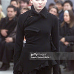 Comme des Garçons - Runway - Fall/Winter 2002-2003 Paris Fashion Week
PARIS, FRANCE - MARCH 07: A model walks the runway during the Comme des Garçons Ready to Wear Fall/Winter 2002-2003 fashion show as part of the Paris Fashion Week on March 7, 2002 in Paris, France. (Photo by Victor VIRGILE/Gamma-Rapho via Getty Images)