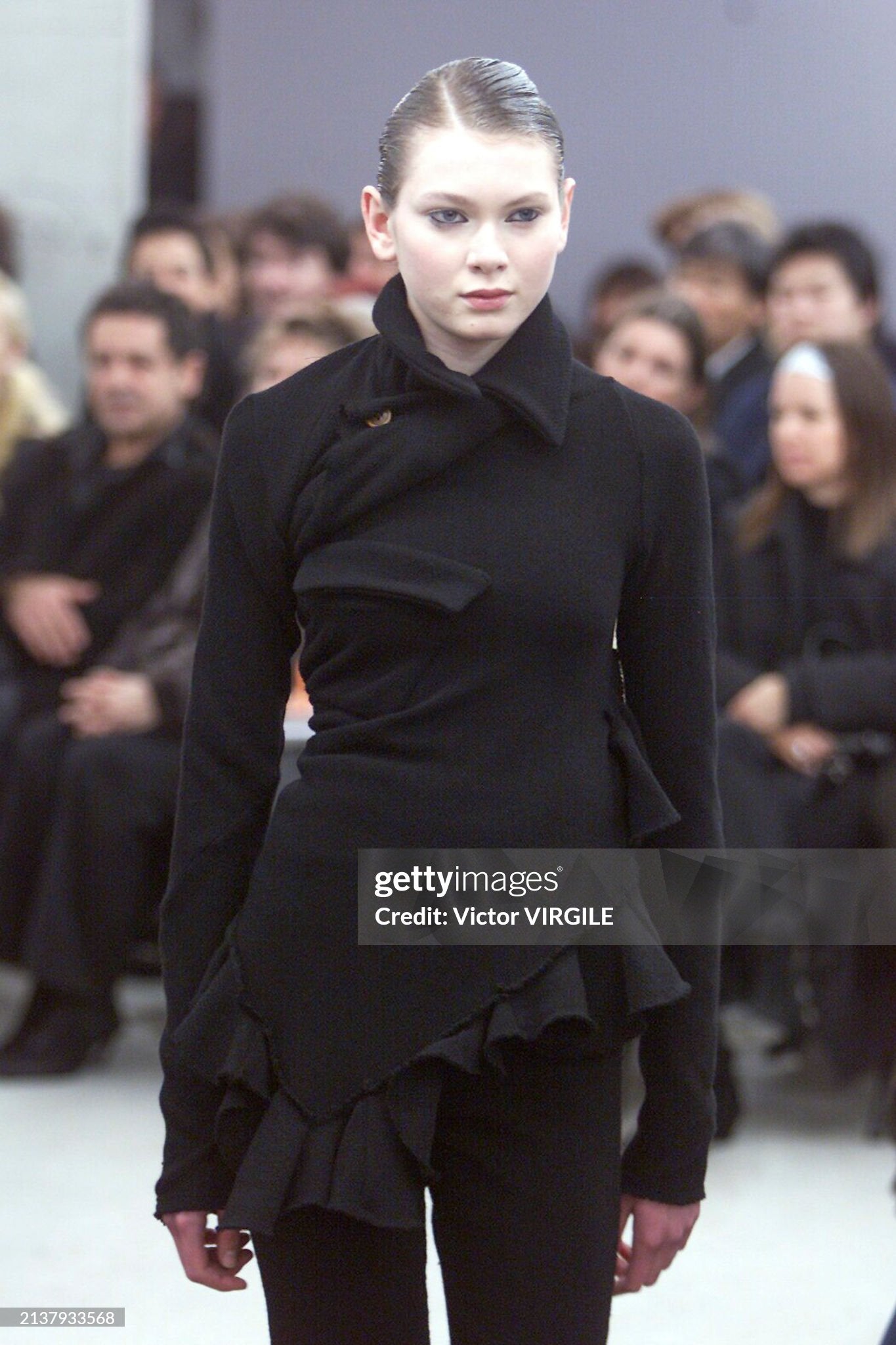 Comme des Garçons - Runway - Fall/Winter 2002-2003 Paris Fashion Week
PARIS, FRANCE - MARCH 07: A model walks the runway during the Comme des Garçons Ready to Wear Fall/Winter 2002-2003 fashion show as part of the Paris Fashion Week on March 7, 2002 in Paris, France. (Photo by Victor VIRGILE/Gamma-Rapho via Getty Images)