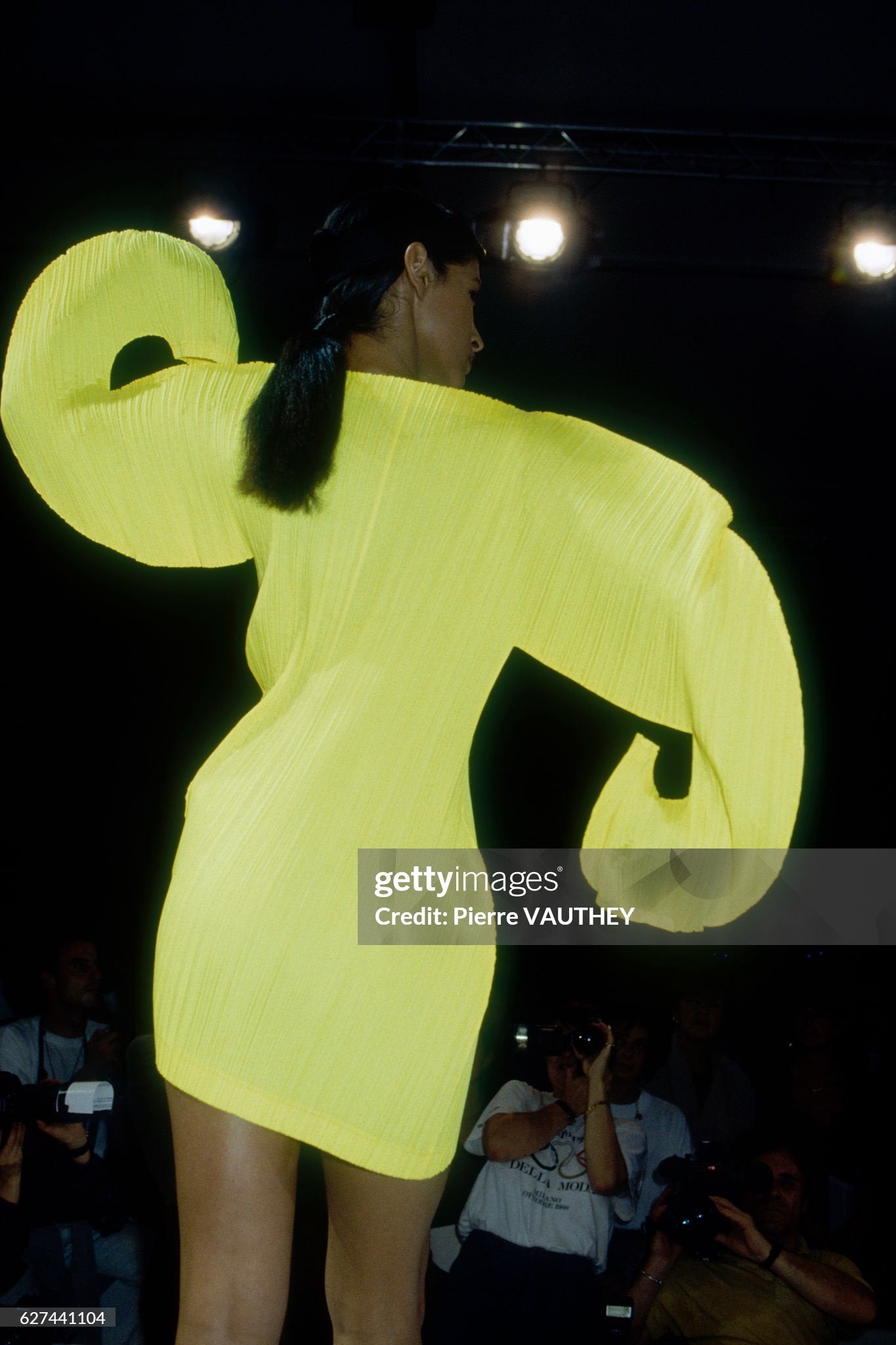 Issey Miyake 1991 Spring-Summer Fashion Show
Japanese designer Issey Miyake shows his women's 1991 spring-summer ready-to-wear line in Paris. The model is wearing a yellow dress with curved sleeves. (Photo by Pierre Vauthey/Sygma/Sygma via Getty Images)

