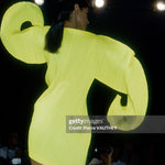 Issey Miyake 1991 Spring-Summer Fashion Show
Japanese designer Issey Miyake shows his women's 1991 spring-summer ready-to-wear line in Paris. The model is wearing a yellow dress with curved sleeves. (Photo by Pierre Vauthey/Sygma/Sygma via Getty Images)
