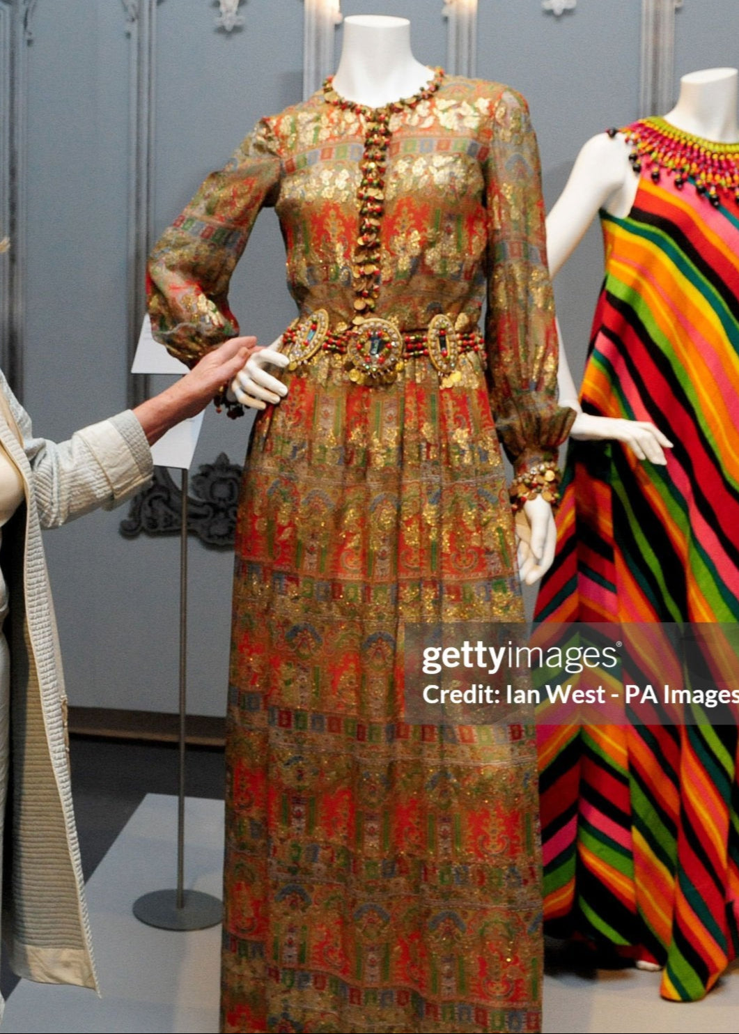 Lady Anne Glenconner is seen at the private viewing of The Glamour of Bellville Sassoon, with the dress she donated to the exhibition, at the Fashion and Textile Museum in London. (Photo by Ian West/PA Images via Getty Images)