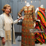 Lady Anne Glenconner with the Bellville Sassoon gown she donated to the exhibit.