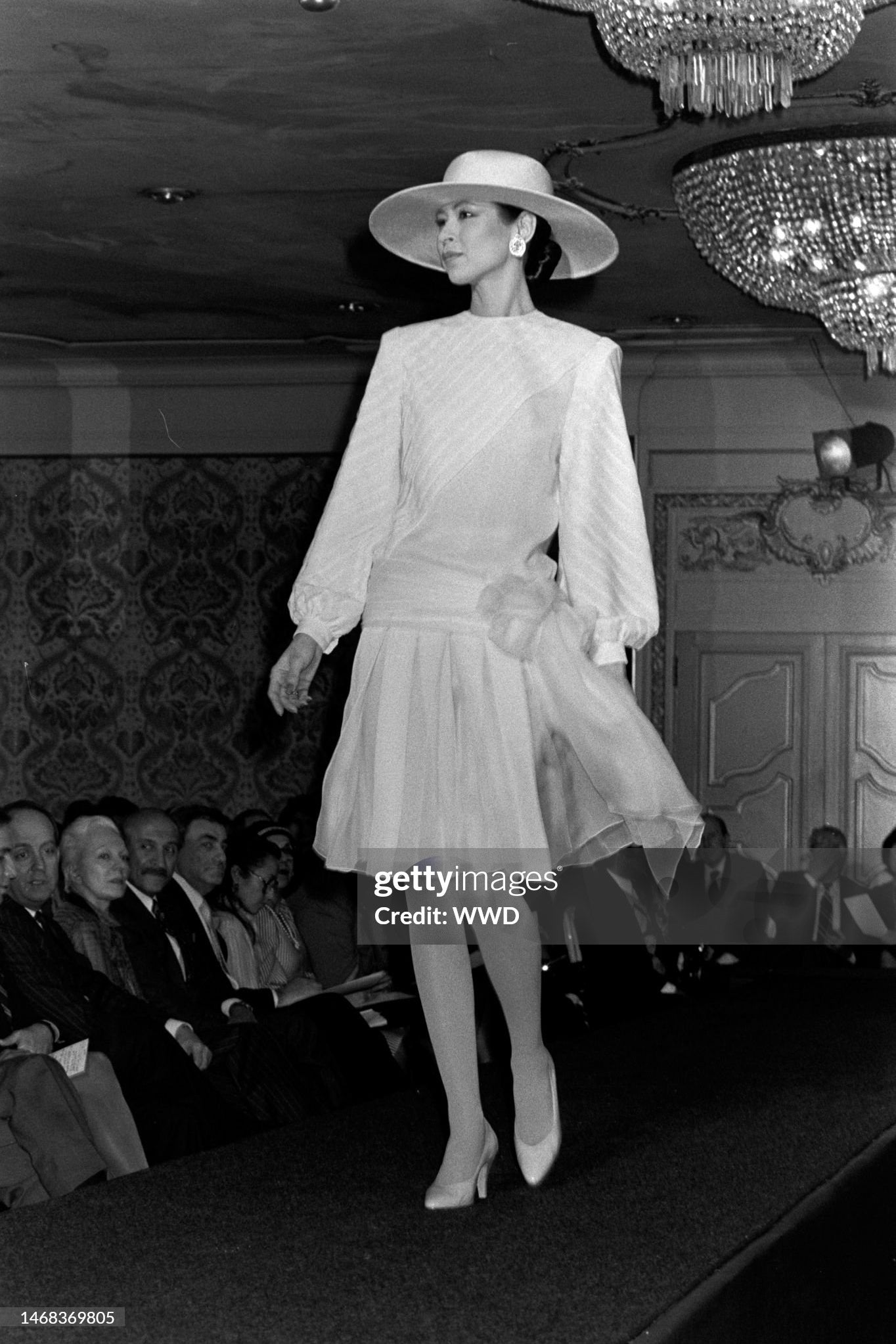 Galanos 1984 Black Silk Tiered Gown with Decorative Hip Flower, Getty image of runway